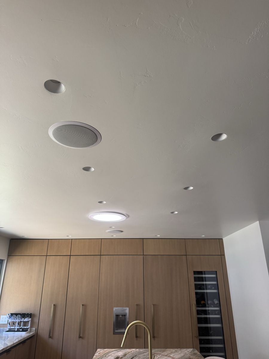 Flangeless DMF recessed lights, ceiling speaker and dimmable Solatube in a modern kitchen